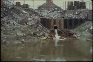 Sources of Water Pollution: Waste being Discharged into the Cuyahoga River by Harshaw Chemical Company (Credit: Frank J. (Frank John) Aleksandrowicz, 1921-, Photographer 1973)